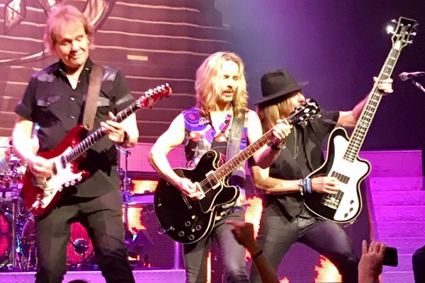 James 'JY' Young, Tommy Shaw and Ricky Phillips jamming together at center stage